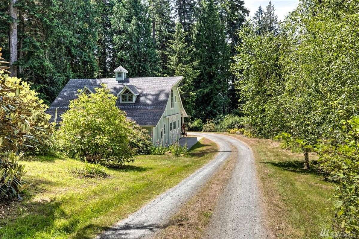 Enjoy a stunning, secluded 38 acres with this Freeland estate