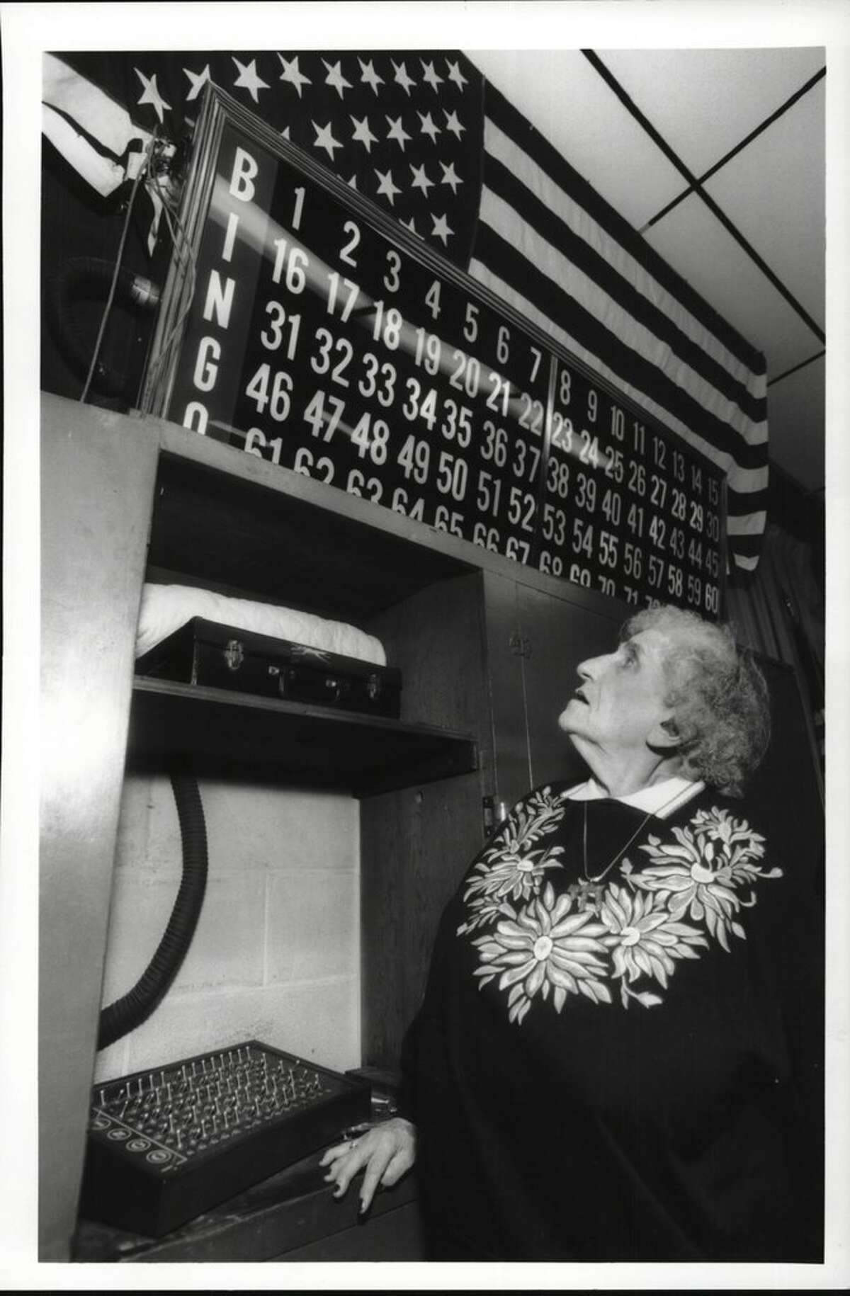 Ancient Order of Hiberians Hall, Quail Street, Albany, New York - Mrs. Bingo, Hilda Gordon, one of the congregation who runs Wednesday night bingo for Ohav Shalom. Hilda is working the number board keeping track of the numbers called. January 19, 1994 (Luanne M. Ferris/Times Union Archive)