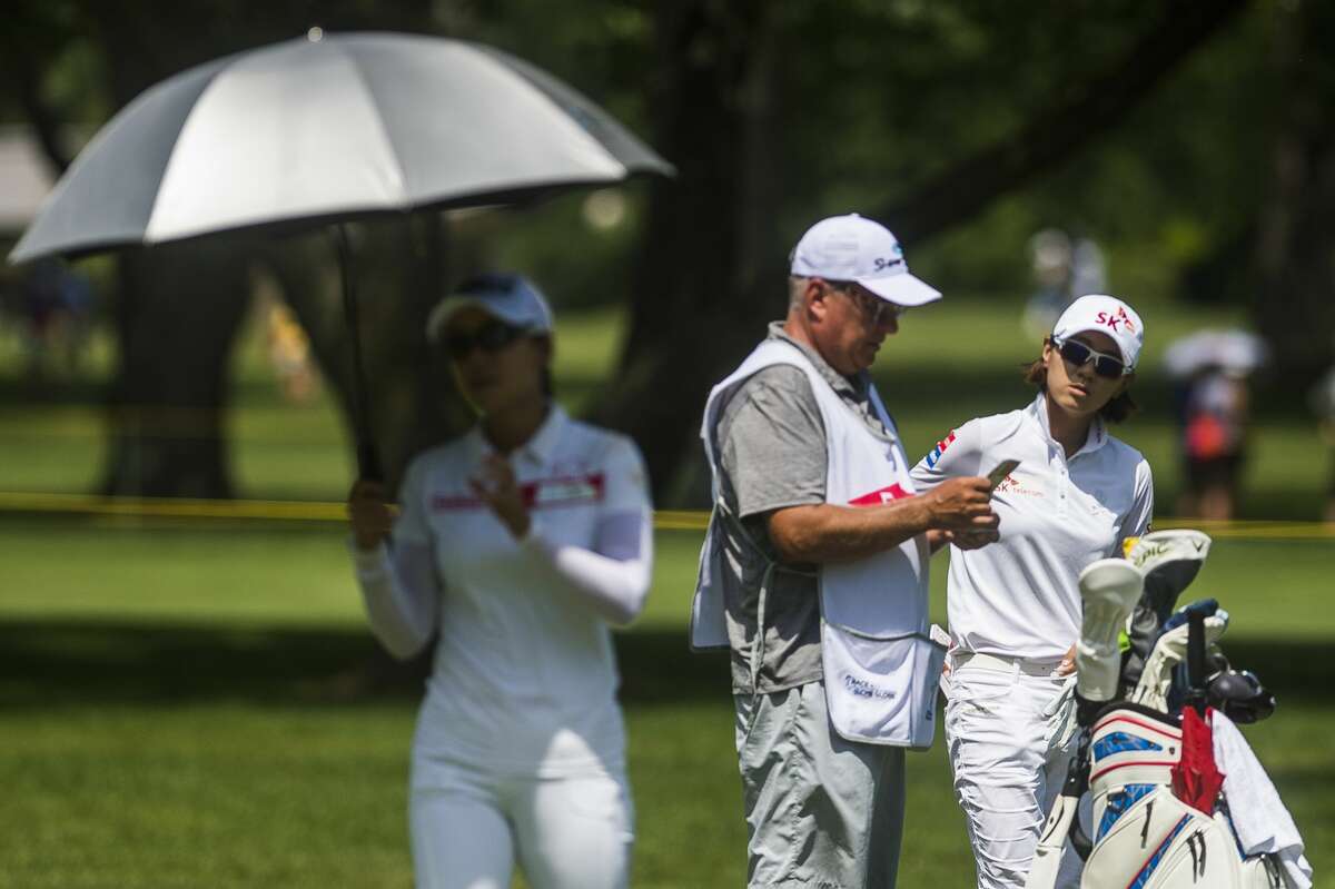 Na Yeon Choi of Korea, right, glances over at her playing partner, Jenny Shin of Korea, left, as they play in the third round of the Dow Great Lakes Bay Invitational on Friday, July 19, 2019 at Midland Country Club. (Katy Kildee/kkildee@mdn.net)