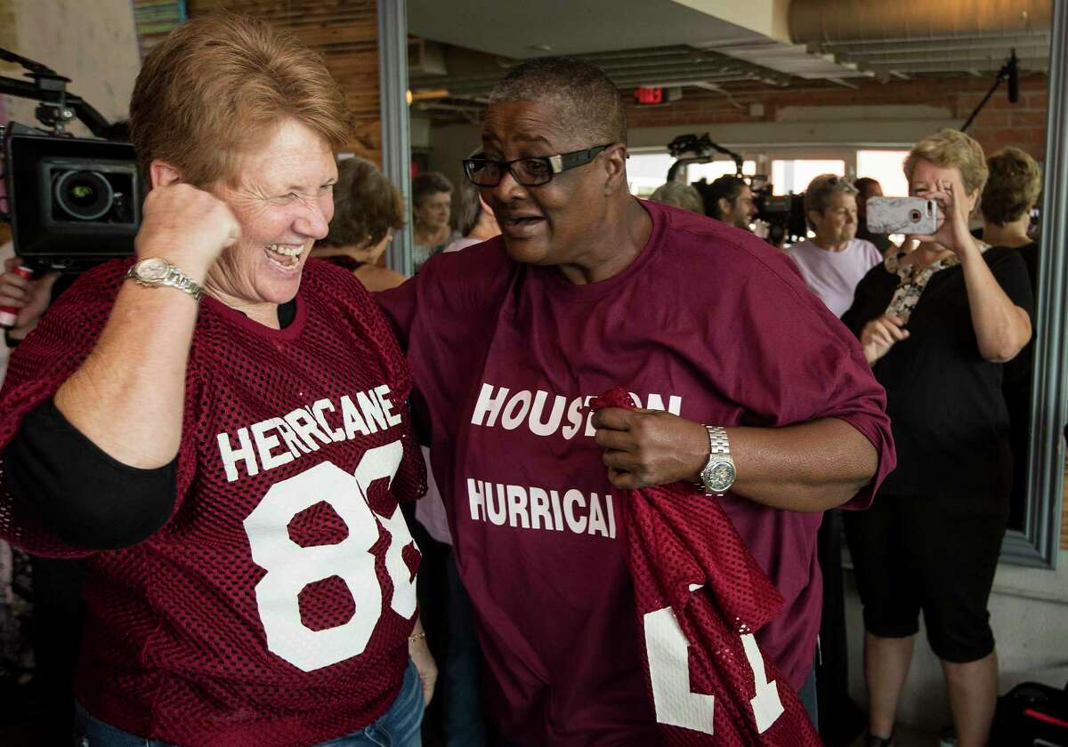 Billie Cooper laughs with her former teammate Rose Kelley during a reunion of players from the Houston Herricanes, the city's first professional women's football team, on Saturday, July 13, 2019, in Houston. The reunion marked the first time in 40 years the women who played in the NWFL gathered to relive the memories of their playing days.