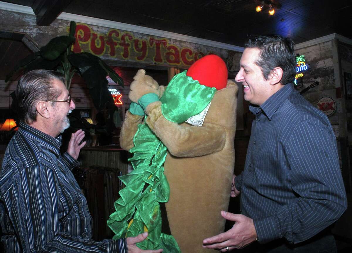 The mascot’s recipe for success hasn’t changed much since 1989, when a young Jaime Lopez (shown right in 2012) first cooked up the idea with former Missions assistant general manager David Oldham to promote Henry’s Puffy Tacos, which Lopez’s dad Henry (shown left) launched in 1978.