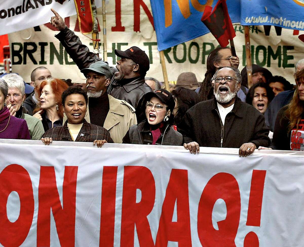 PROTEST24-c-16FEB03-MT-SS --- The big-name protestors leading the demosnstration are from left to right: Bonnie Raitt, Congresswoman Barbara Lee, actor Danny Glover, Janince Mirikitani, and Rev. Cecil Williams. SF CHRONICLE PHOTO BY SCOTT SOMMERDORF