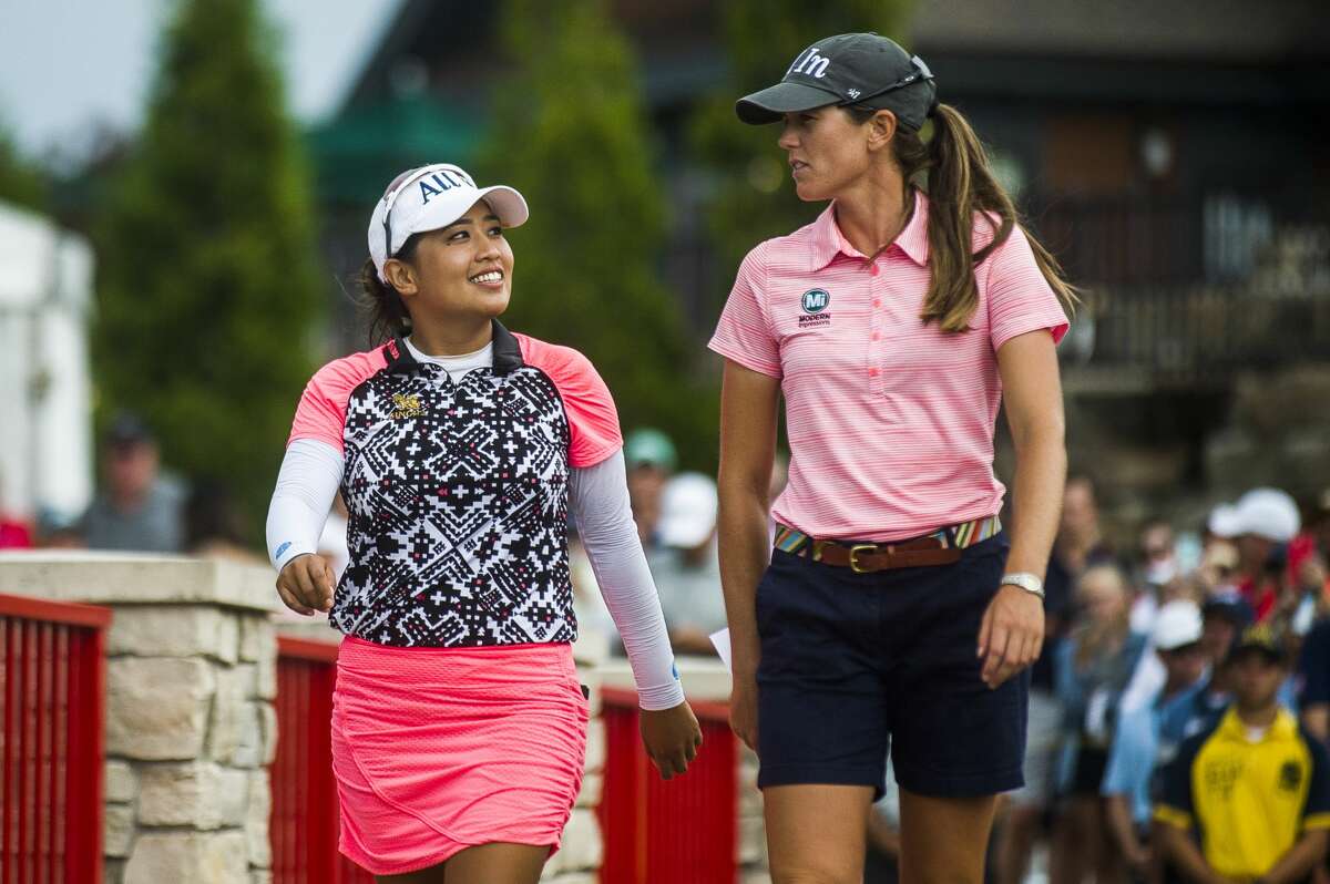 Jasmine Suwannapura of Thailand, left, and her playing partner Cydney Clanton of Alabama, right, celebrate after winning the Dow Great Lakes Bay Invitational on Saturday, July 20, 2019 at Midland Country Club. (Katy Kildee/kkildee@mdn.net)