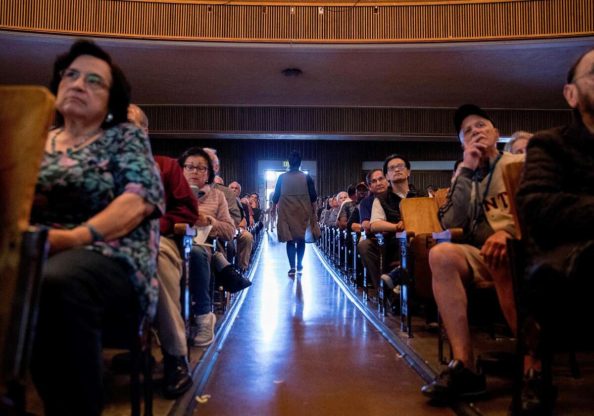 Neighbors and residents gather in the auditorium of Balboa High School to attend a community meeting held at Balboa High School in San Francisco, Calif. Saturday, July 20, 2019 addressing the proposed safe parking center near the Balboa BART Station for people who are homeless and live in their cars.