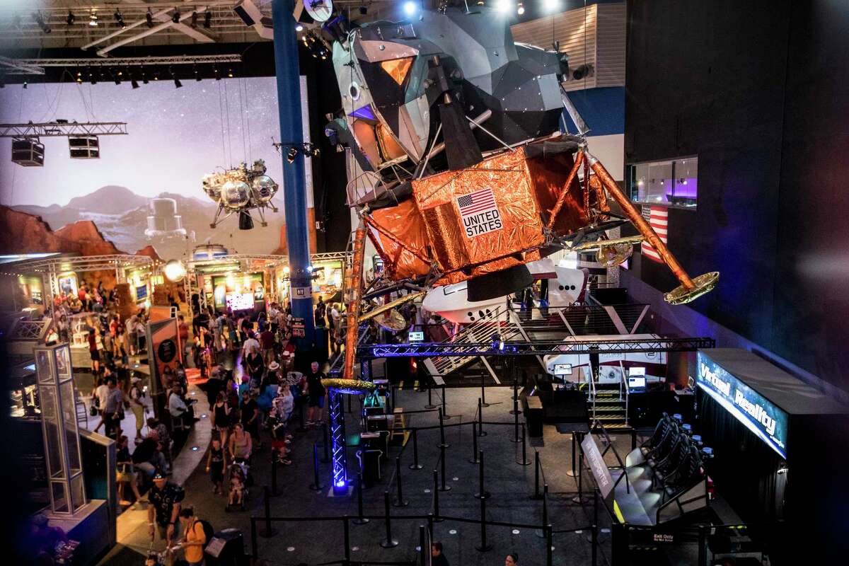A lunar module model is shown above the crowd during the 50th anniversary celebration of the Apollo 11 moon landing at Space Center Houston on Saturday, July 20, 2019, in Houston.