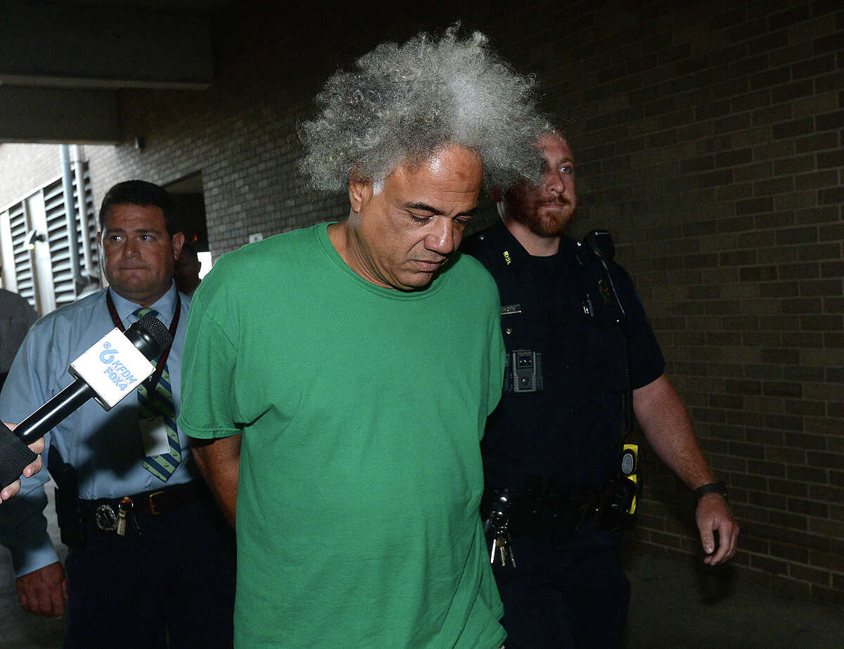 Ronald Goeloe, 51, of Beaumont is led out of the Beaumont Police Department Friday after being arrested and charged with murder in the death of Joyce Marie Acey, 49, of Beaumont. Acey's body was found dead in a garage apartment on Evalon Avenue Thursday night. Photo taken Friday, July 19, 2019 Kim Brent/The Enterprise