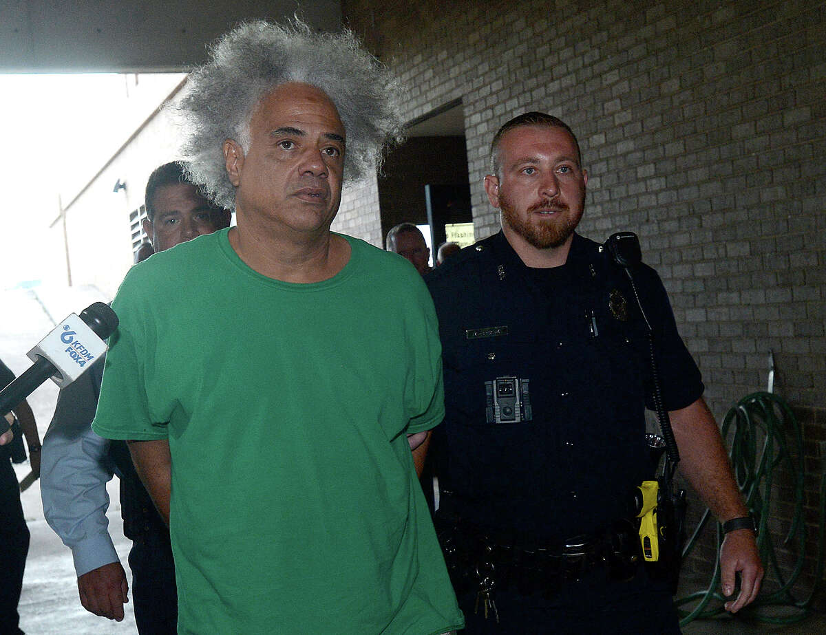 Ronald Goeloe, 51, of Beaumont is led out of the Beaumont Police Department Friday after being arrested and charged with murder in the death of Joyce Marie Acey, 49, of Beaumont. Acey's body was found dead in a garage apartment on Evalon Avenue Thursday night. Photo taken Friday, July 19, 2019 Kim Brent/The Enterprise