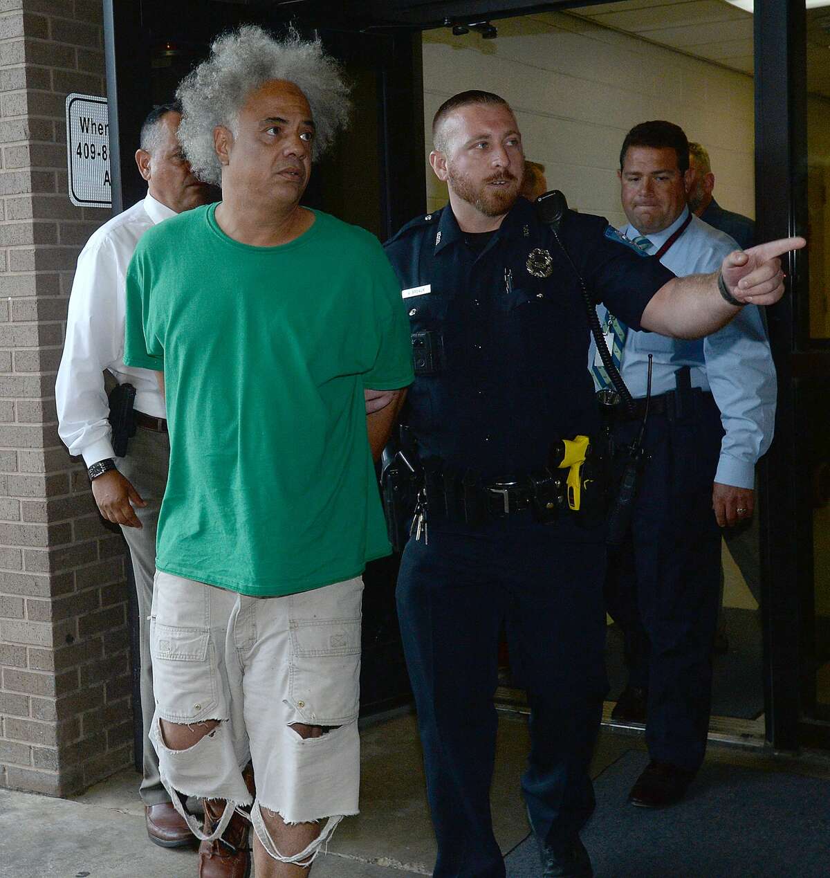 Ronald Goeloe, 51, of Beaumont is led out of the Beaumont Police Department Friday after being arrested and charged with murder in the death of Joyce Marie Acey, 49, of Beaumont. Acey's body was found dead in a garage apartment on Evalon Avenue Thursday night. Photo taken Friday, July 19, 2019 Kim Brent/The Enterprise