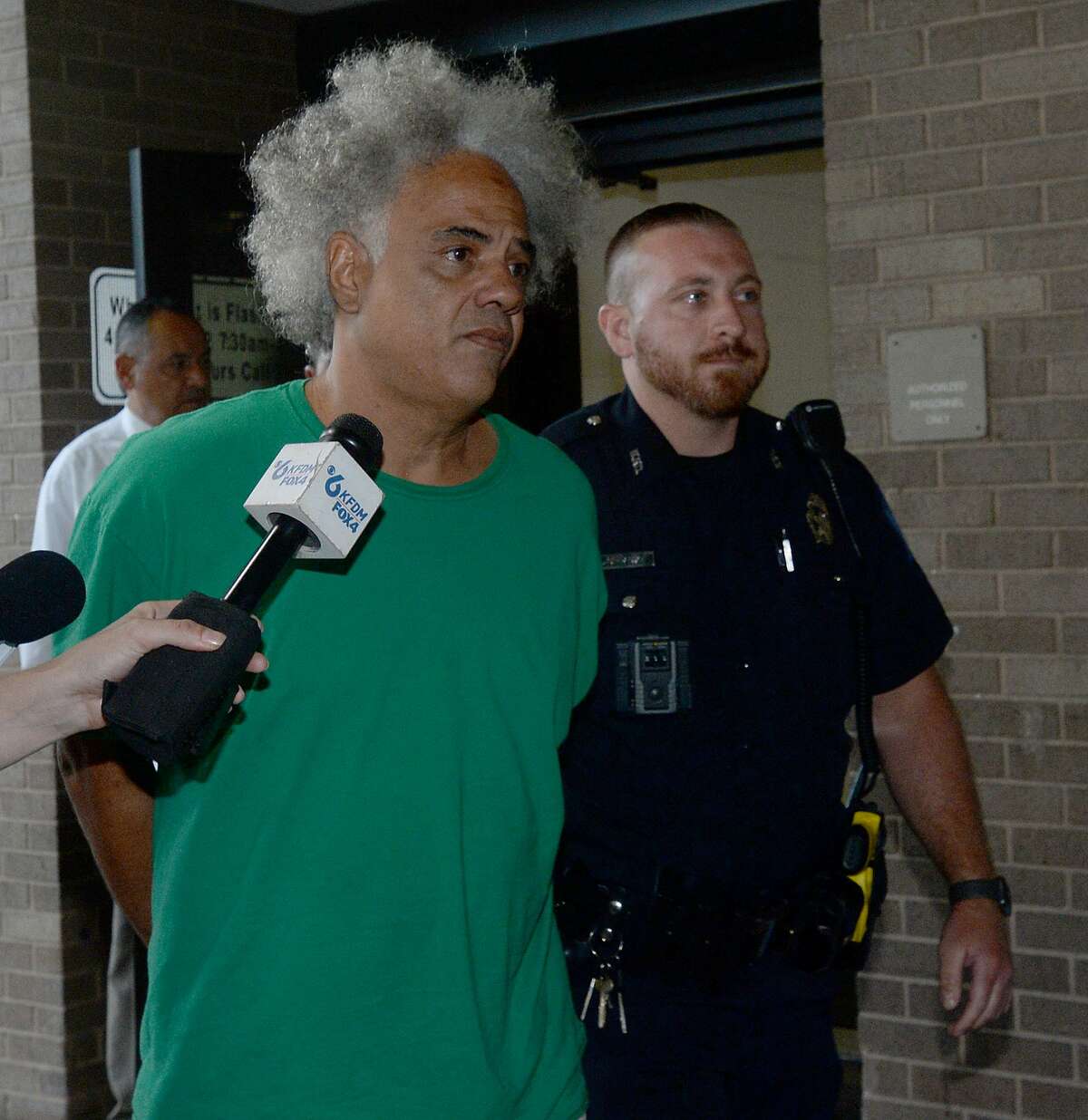 Ronald Goeloe, 51, of Beaumont is led out of the Beaumont Police Department Friday after being arrested and charged with murder in the death of Joyce Marie Acey, 49, of Beaumont. Acey's body was found dead in a garage apartment on Evalon Avenue Thursday night. Photo taken Friday, July 19, 2019 Kim Brent/The Enterprise