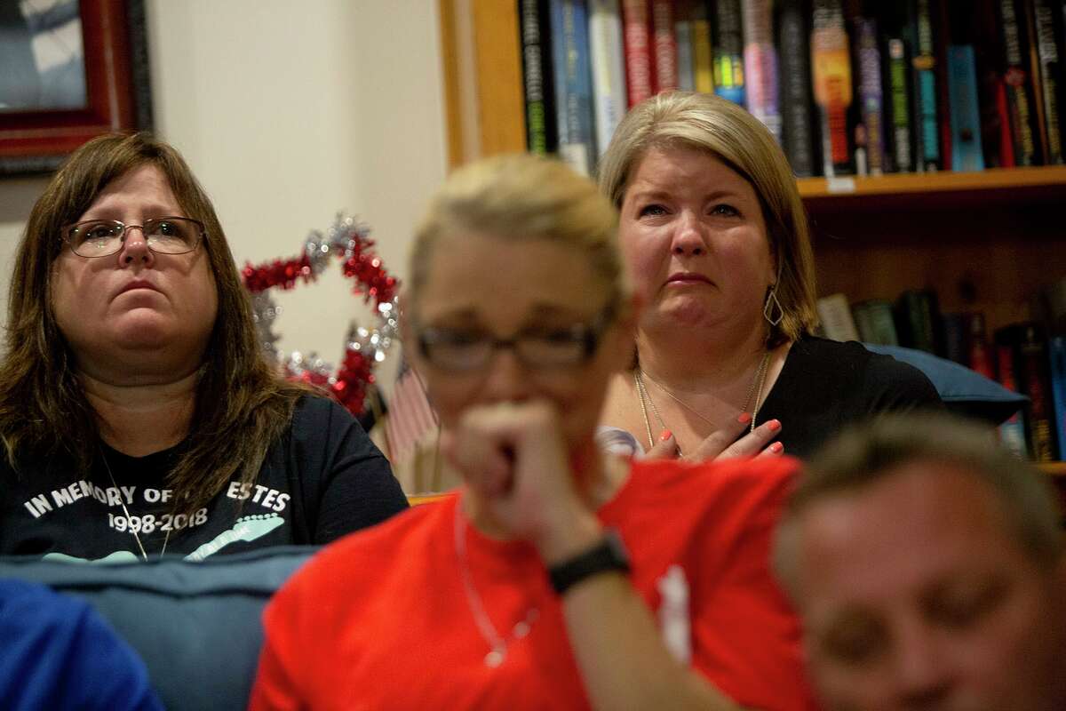 The families of those killed or severely injured in a deliberately set fire at Iconic Village Apartments in San Marcos gathered to grieve together on the one-year anniversary of the crime. Shown left to right are Cheryl Estes, the mother of fire victim Dru Estes; Deona Jo “DJ” Sutterfield, the mother of survivor Zachary Sutterfield; Michele Frizzell, the mother of fire victim Haley Frizzell; and Karl Sutterfield, the father of Zachary Sutterfield.