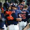 Houston Astros Michael Brantley (23) celebrates his two-run home run off of Texas Rangers starting pitcher Lance Lynn with George Springer during the first inning of an MLB baseball game at Minute Maid Park, Sunday, July 21, 2019.