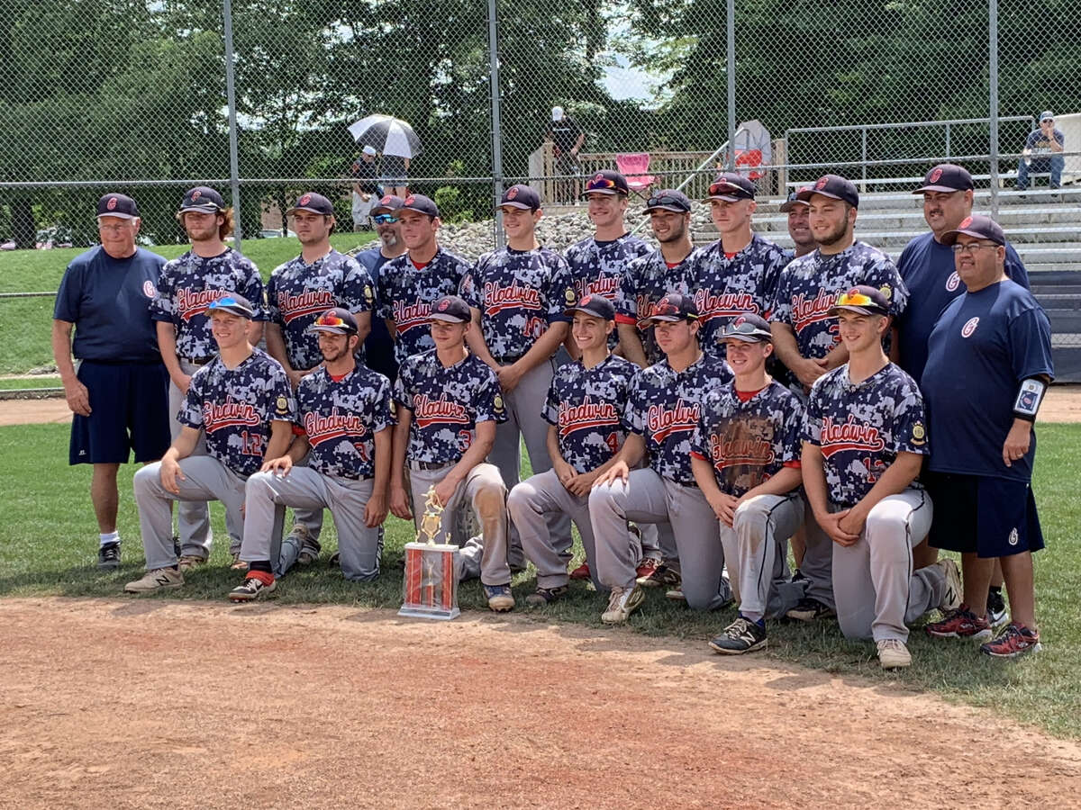 Gladwin Post 171 poses with its trophy after winning its first-ever American Legion Baseball district/zone championship at Northwood on Sunday.