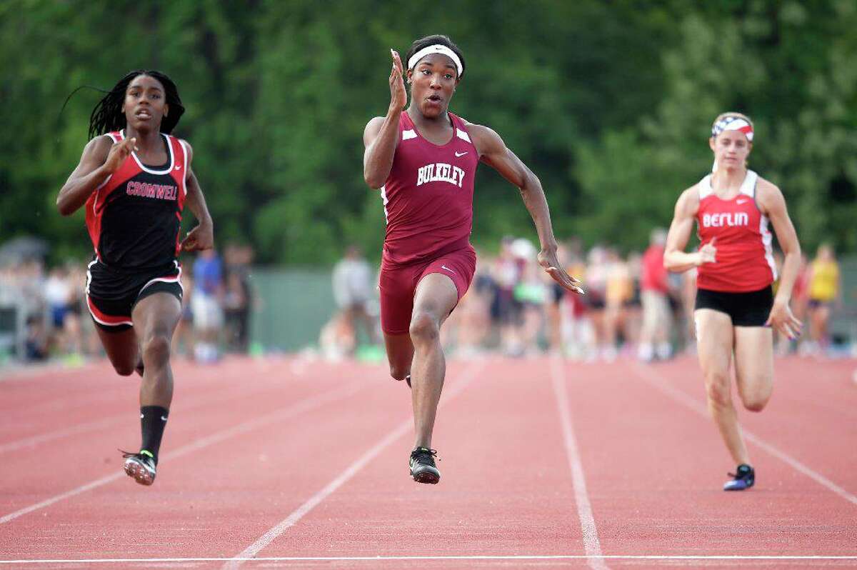 Terry Miller breezed to a first place finish in the 100 meter dash with a time of 11.77 seconds during the State Class M outdoor high school boys and girls track and field championship at Veterans Memorial Stadium in New Britain in May 2018. Andraya Yearwood (L) of Cromwell placed 2nd and Nikki Xiarhos (R) of Berlin placed 3rd. (file photo)