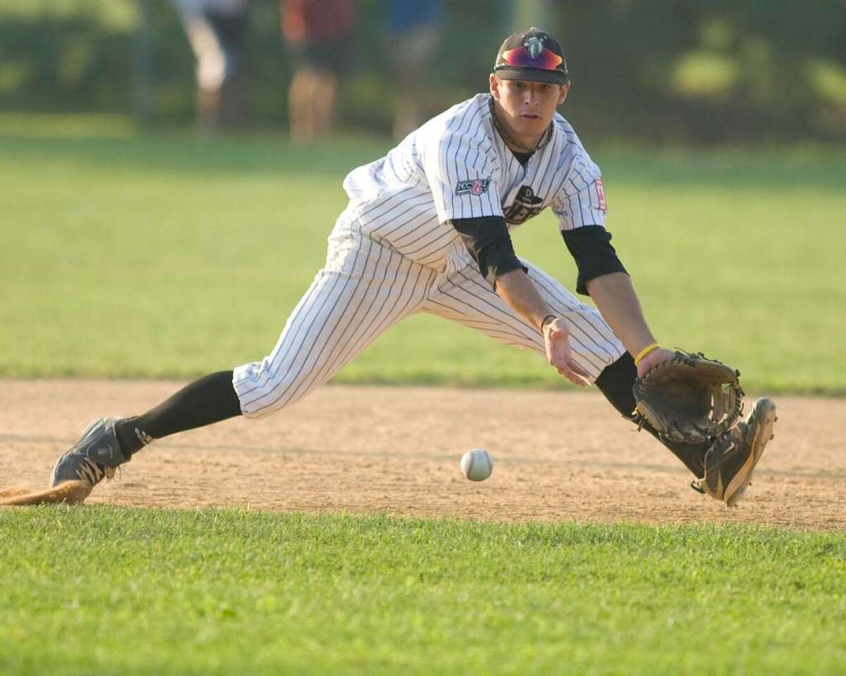 Westerners' third baseman Brian Kownacki goes to his left to glove a ball in the hole against North Adams Wednesday night at Rogers Park.