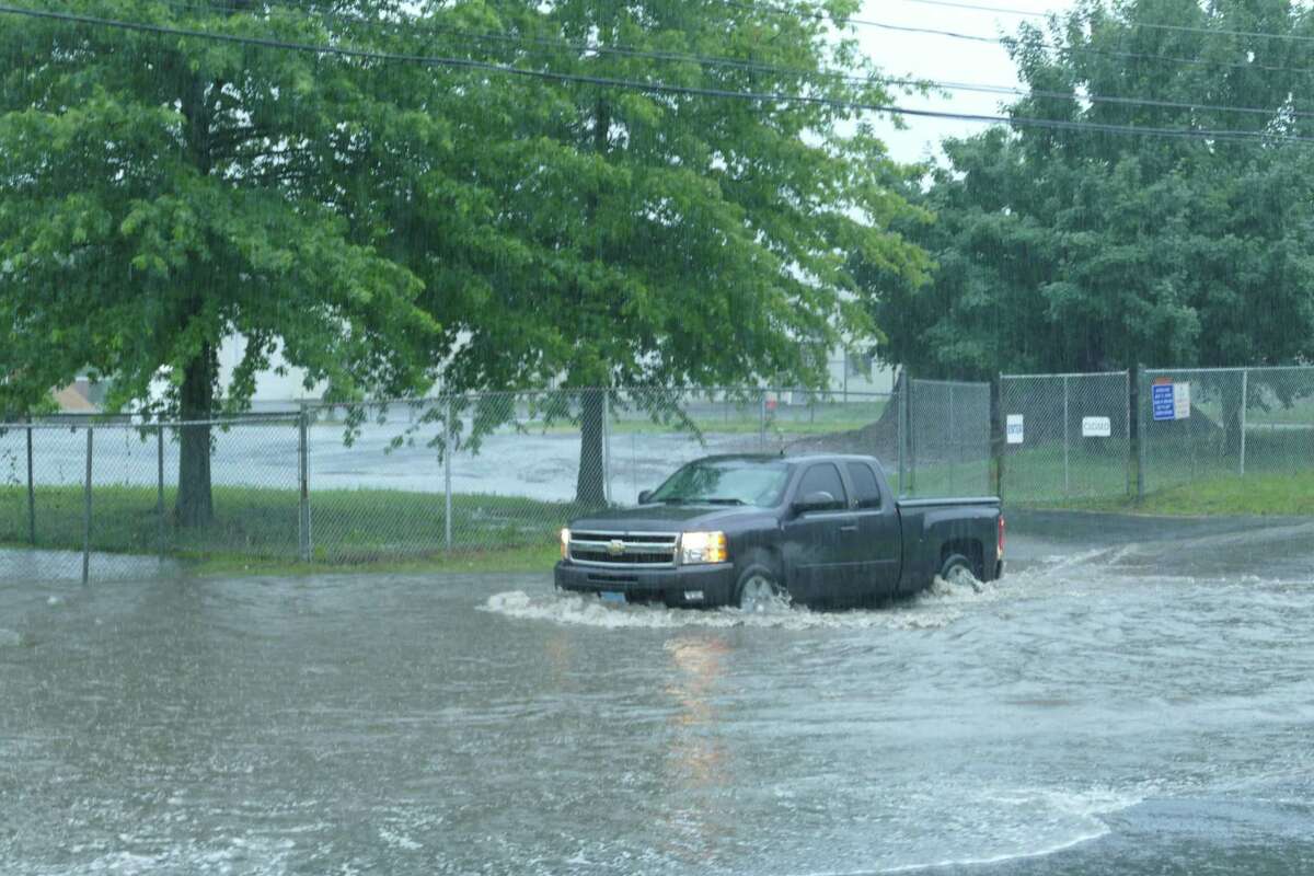 Flooding on South Street in Ridgefield had cars turning around in both directions Monday, July 22, 2019.