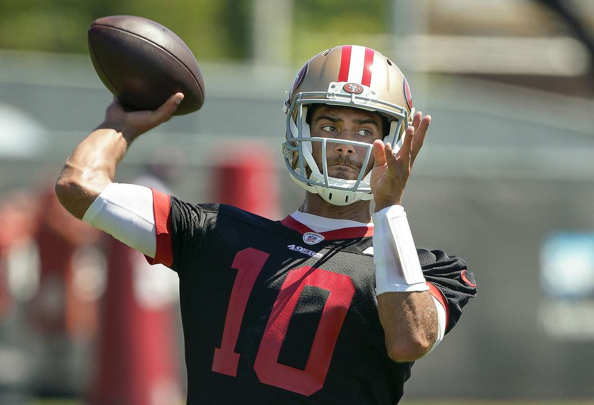 FILE - In this June 10, 2019, file photo, San Francisco 49ers quarterback Jimmy Garoppolo throws a pass during a drill at the team's NFL football training facility in Santa Clara, Calif. Garoppolo is going to summer school before starting training camp with the 49ers. Garoppolo is spending part of his down time between the end of minicamp and the starting of training camp on July 27 working in Southern California with quarterback guru Tom House. (AP Photo/Tony Avelar, File)
