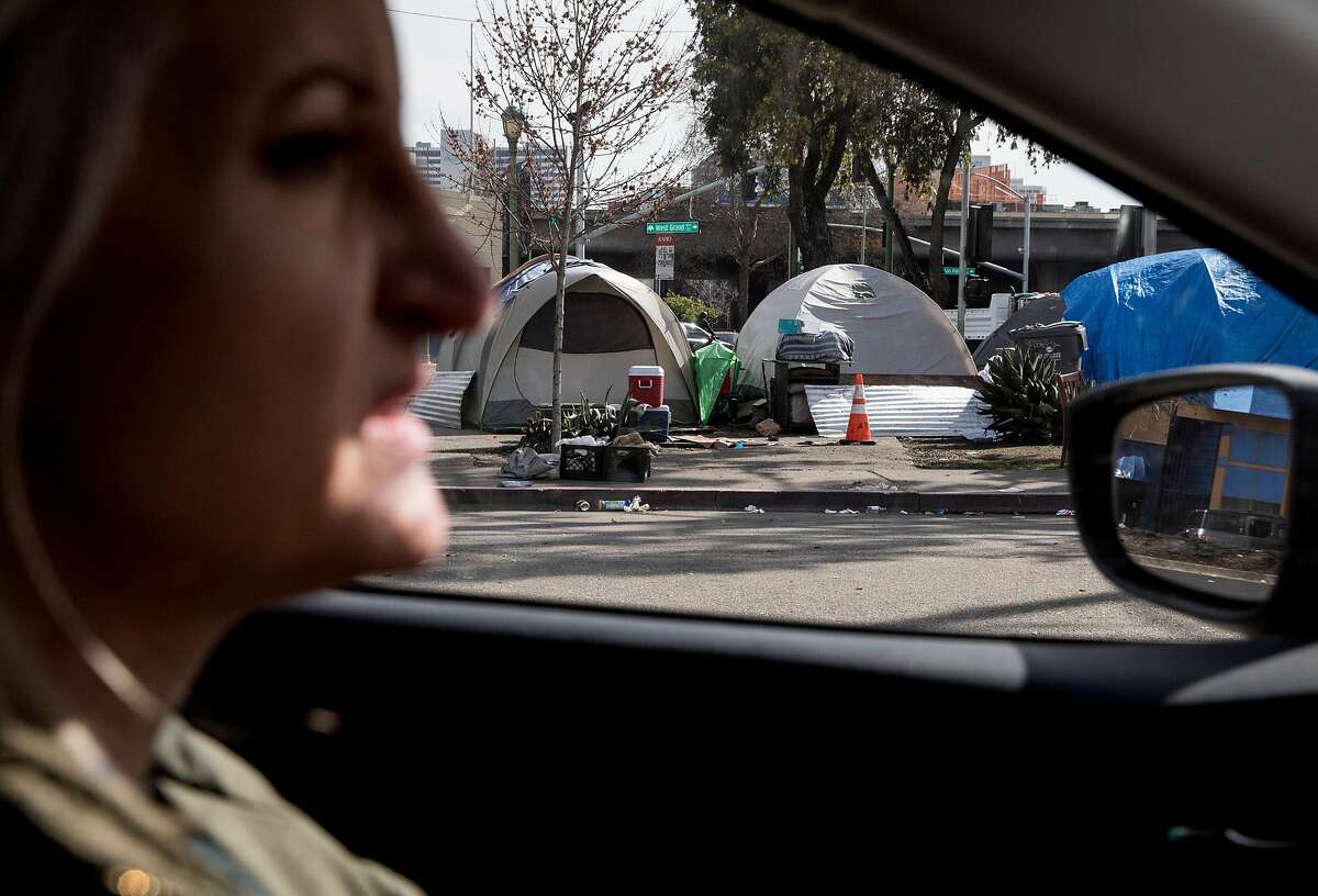 UCSF's HOPE-HOME Project conductor Pamela Olson drives through downtown Oakland looking for missing participants of their study looking into the trends and lives of the older homeless population in the Bay Area in Oakland, Calif. Thursday, Feb. 7, 2019.