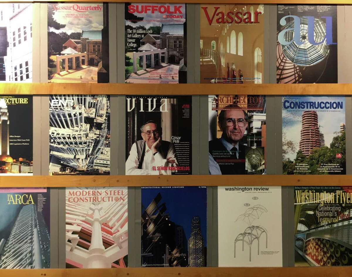 Pelli Clarke Pelli Architects in New Haven continues with more than 100 employees after the death of co-founder Cesar Pelli on Friday. Pictured, magazine covers of the firm's work on a wall at the office.