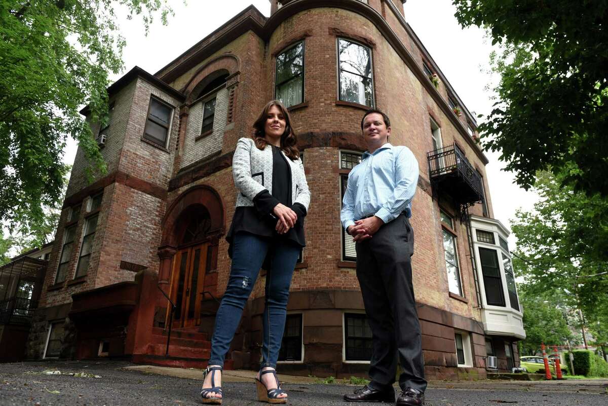 Click through the slideshow to see the 19 apartment buildings that Redburn Development is buying in Schenectady's Stockade neighborhood. Elizabeth Young Jojo, vice president of Redburn Development, left, James Quinn, regional property manager, right, are pictured outside a Redburn apartment building at 11 North Church Street on Tuesday, July 23, 2019, in Schenectady, N.Y. The company recently purchased 19 properties in Schenectady's historic Stockade district. (Will Waldron/Times Union)