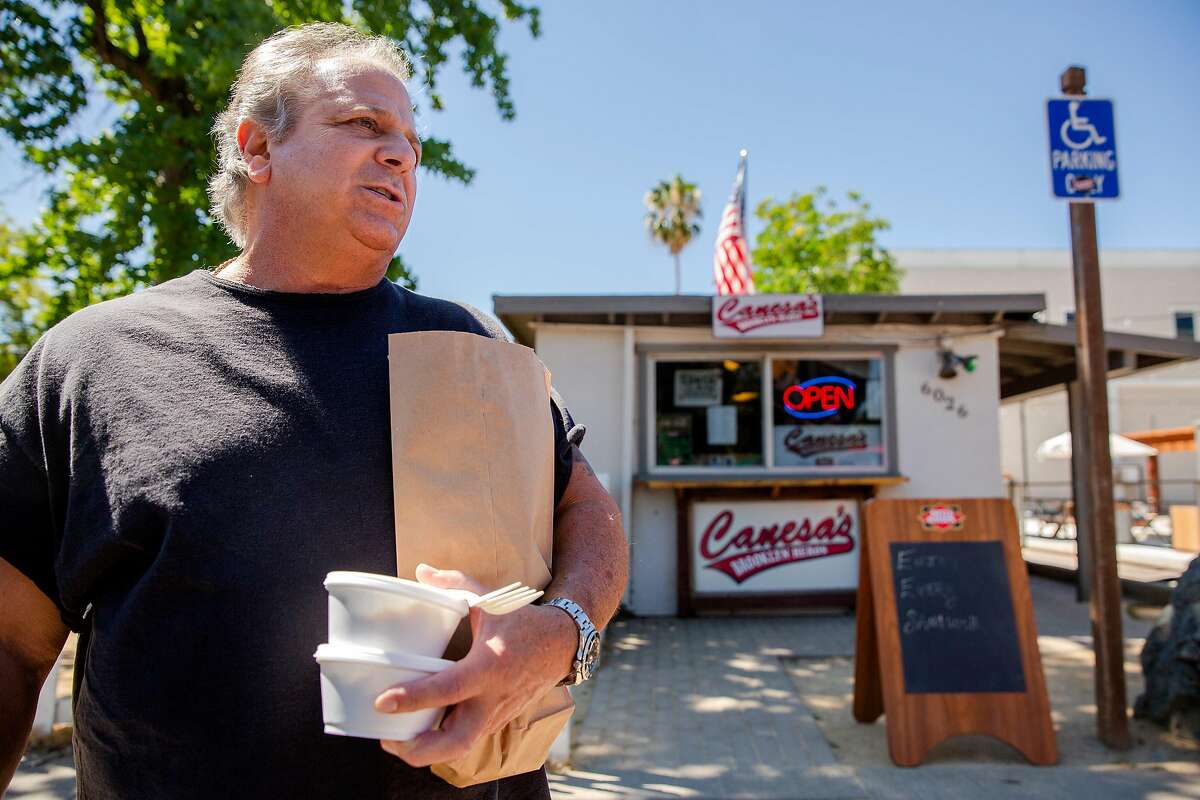 Al, a 30 year Clayton resident, speaks with a San Francisco Chronicle reporter outside of Canesa's Brooklyn Heros deli in Clayton, Calif. on Tuesday, July 23, 2019 after getting his lunch. The East Bay deli owner is facing sharp criticism over a post he placed on his personal Facebook page that appears to be a show of support for the recent racist statements made by President Trump and his backers targeting Rep. Ilhan Omar, D- Minn., and three other congresswomen of color. "Meatballs made with beef today (in case) we offend any of our overly sensitive pork haters!! Free side when you say 'send her back!' " said the Friday post on the page of John Canesa, owner of Canesa's Brooklyn Heros deli.