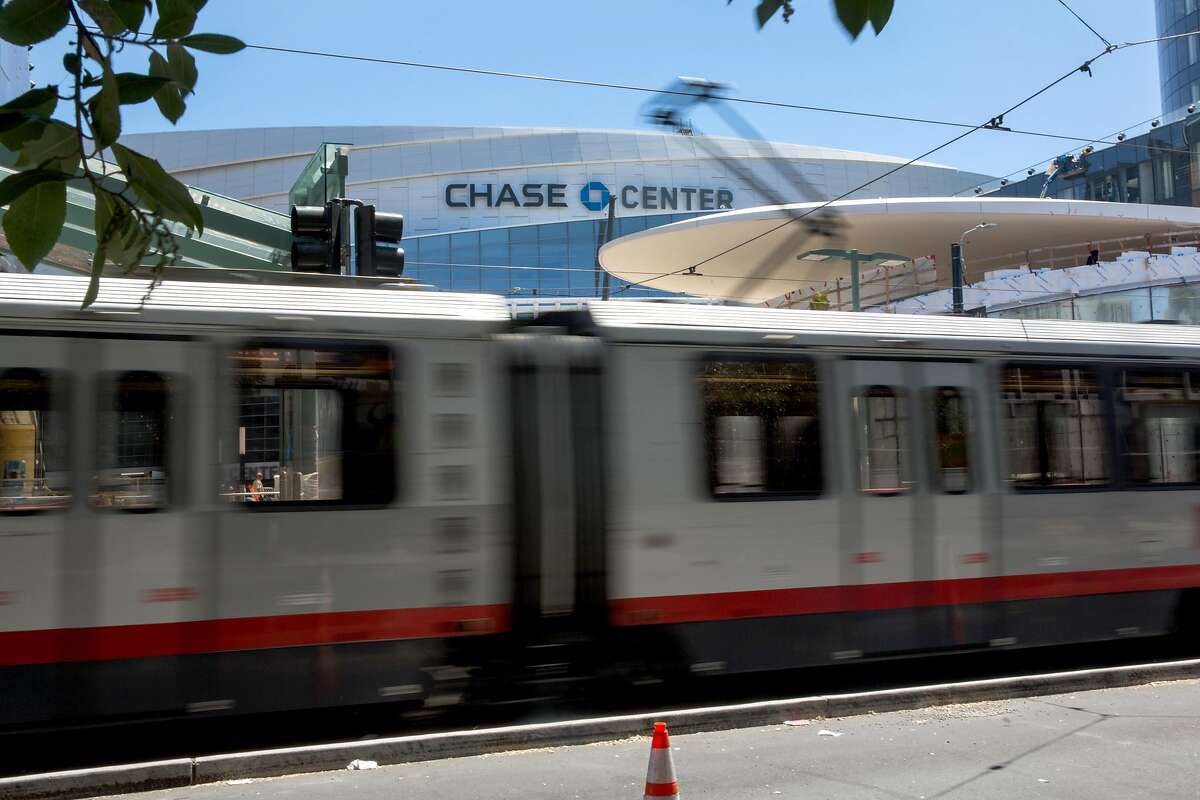 A Muni train T-line passes by a soon functioning Muni stop outside the Chase Center. Any ticket to Chase Center Warriors games, concerts, or any other events will automatically include a ticket to ride on Muni at no additional cost. On Tuesday, July 23, 2019. San Francisco, Calif.