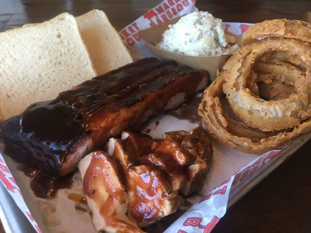 A selection of pork spare ribs, smoked turkey, onion rings and potato salad from Market Barbecue