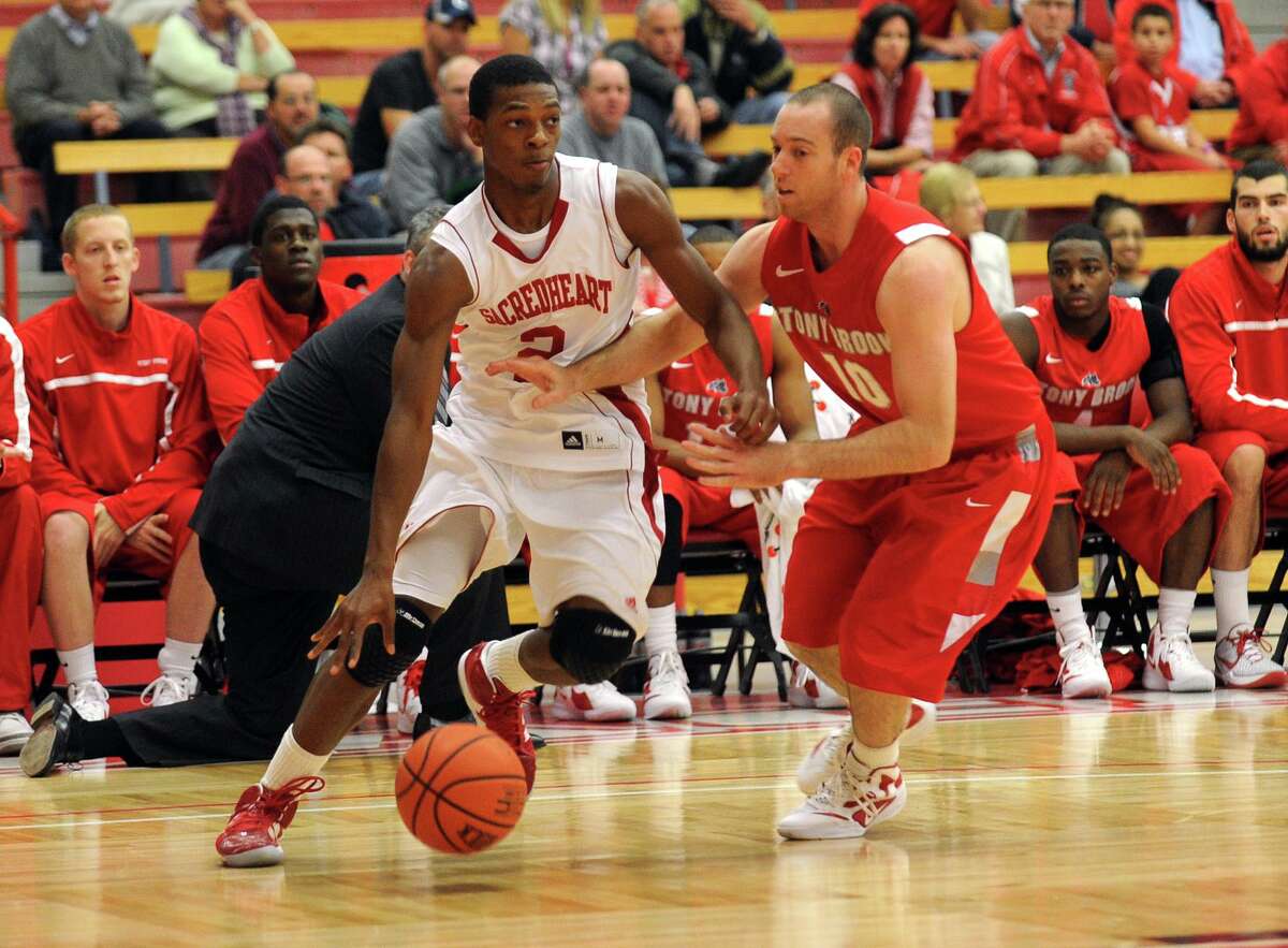 Sacred Heart’s Evan Kelley, left, and Stony Brook’s Bryan Dougher during a game on Nov. 15, 2011.