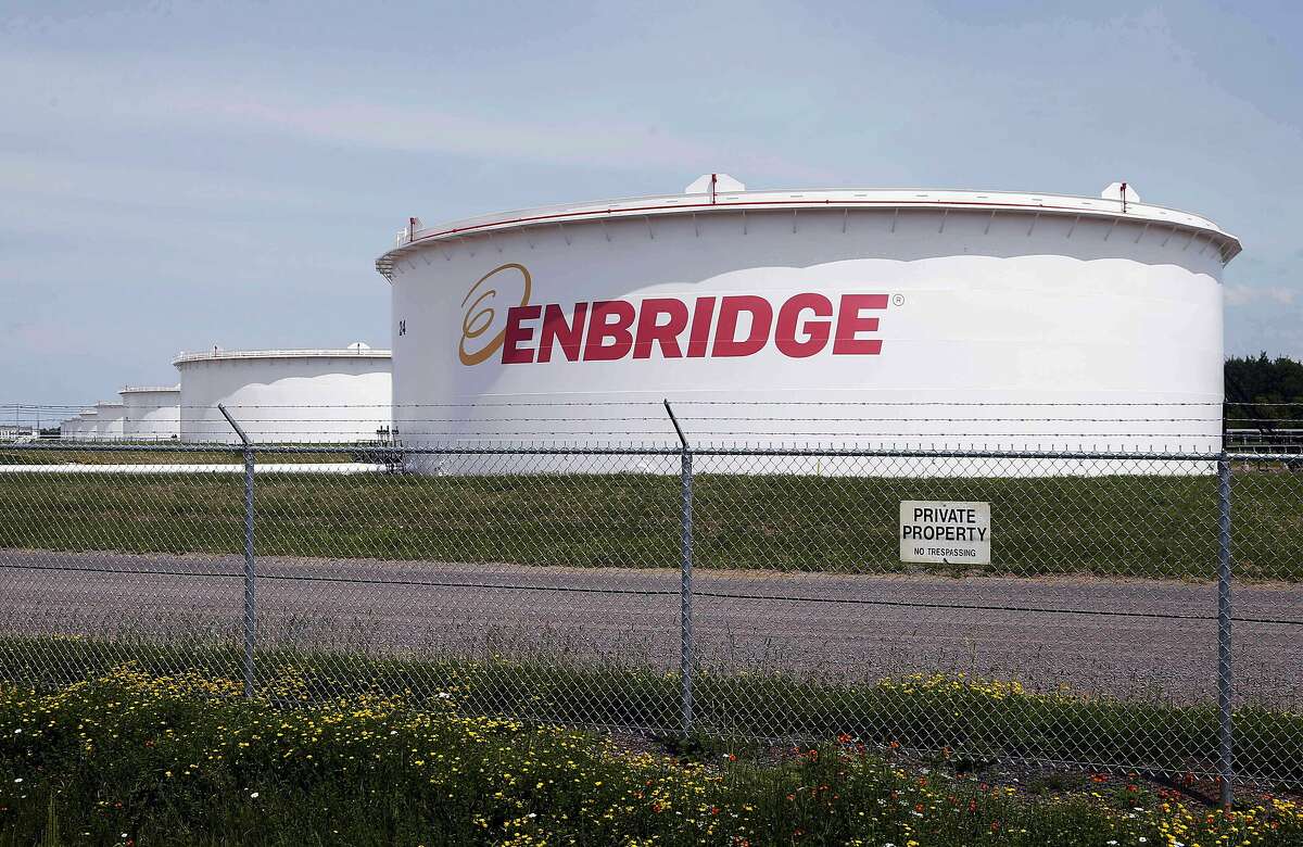 FILE - This June 29, 2018 photo shows tanks at the Enbridge Energy terminal in Superior, Wis.