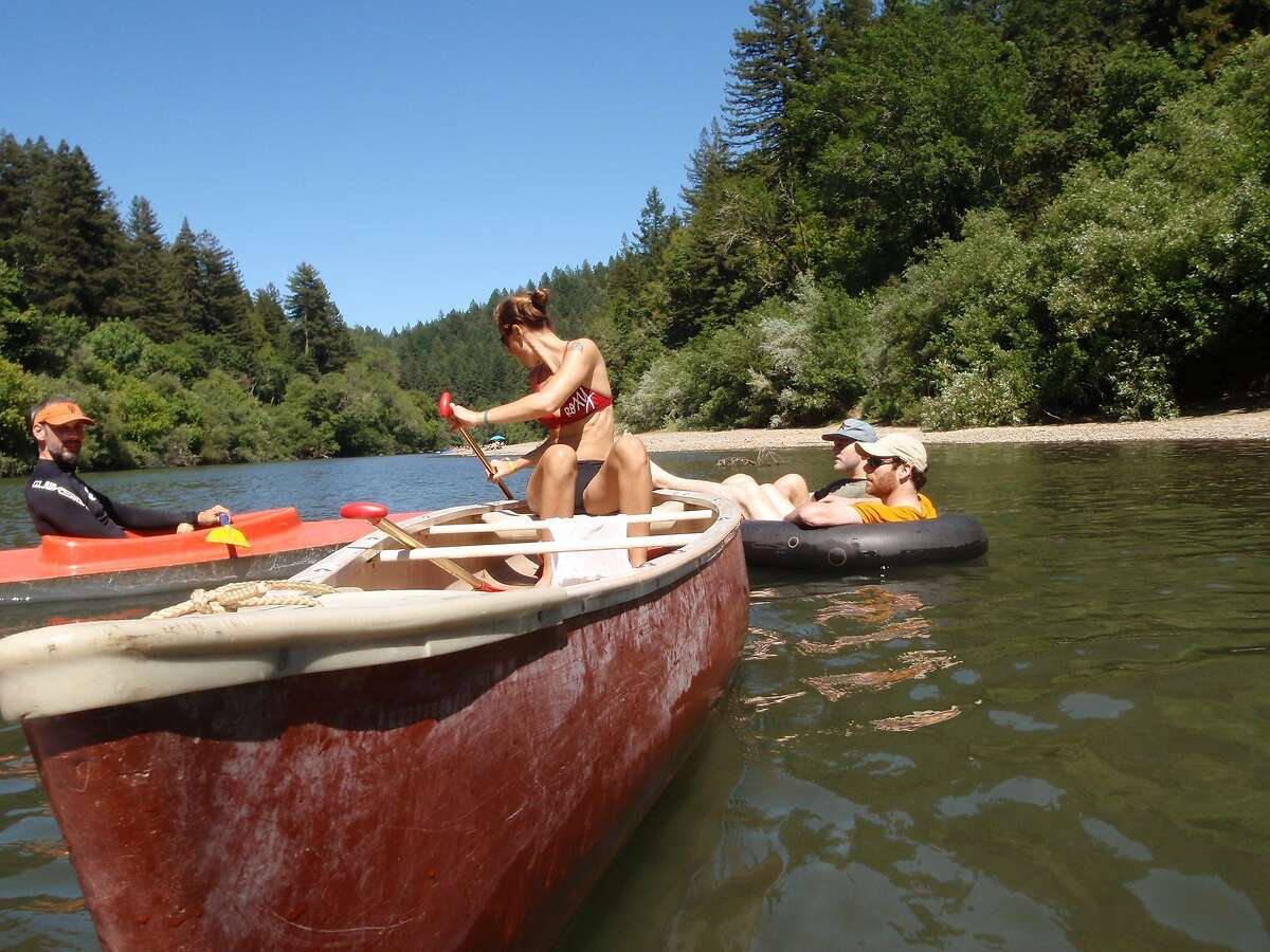 A woman canoes down the Russian River near Guerneville.