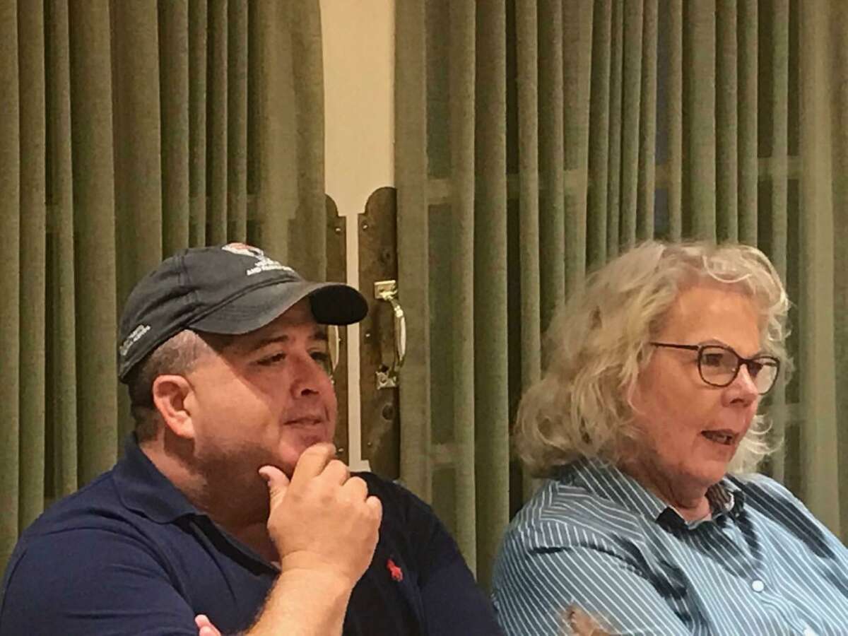 Cheshire Town Council Members Jeff Falk and Patti Flynn-Harris watch as the Democratic Town Committee nominates them to run for another term during a party caucus held Tuesday night at the Cheshire Senior Center.