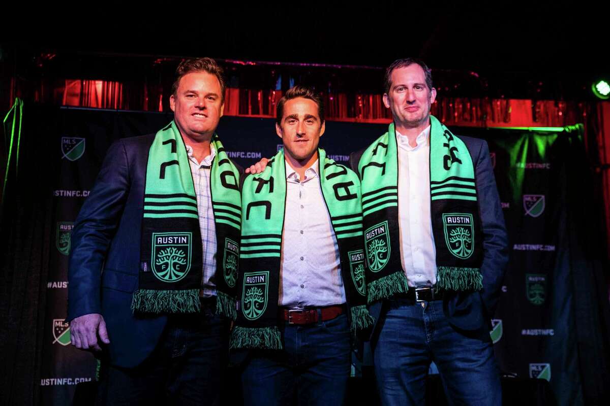 From left, Anthony Precourt, Josh Wolff and Andy Loughnane pose for a photo during a news conference in Austin on Tuesday, July 23, 2019. Former U.S. men's national team player and current assistant coach Josh Wolff will be the first head coach of Austin FC, the new Major League Soccer franchise that is scheduled to begin play in 2021. (Lola Gomez/Austin American-Statesman via AP)