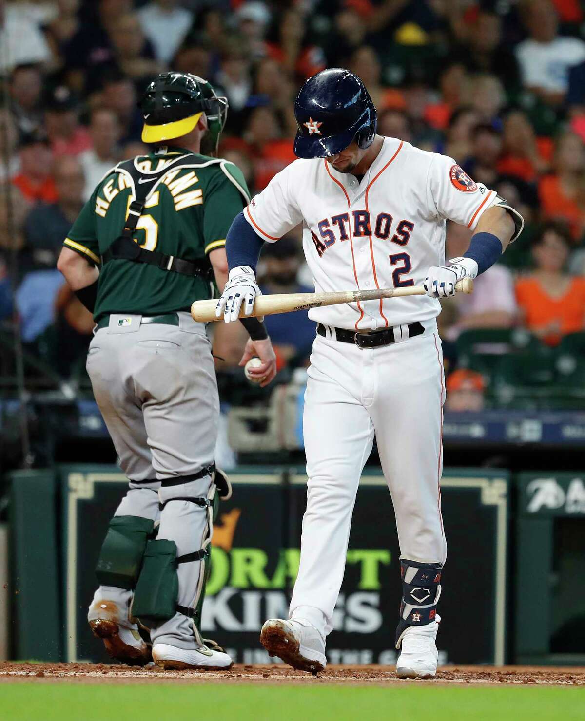 Houston Astros Alex Bregman (2) reacts after striking out against Oakland Athletics starting pitcher Chris Bassitt (40) during the first inning of an MLB baseball game at Minute Maid Park, Wednesday, July 24, 2019.