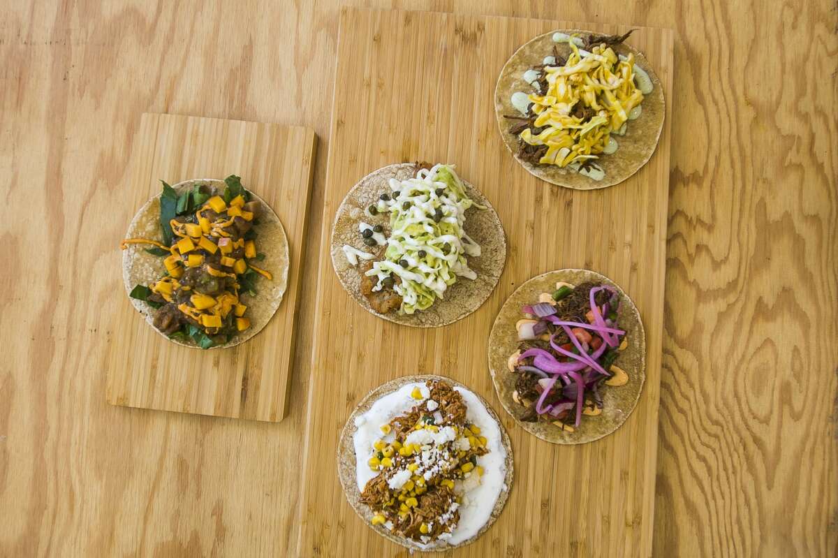 Clockwise from top right, a pork taco, beef taco, chicken taco, vegetarian taco and fish taco can be found on the menu of the newly opened Proper Taco at 139 Ashman Street in downtown Midland. (Katy Kildee/kkildee@mdn.net)