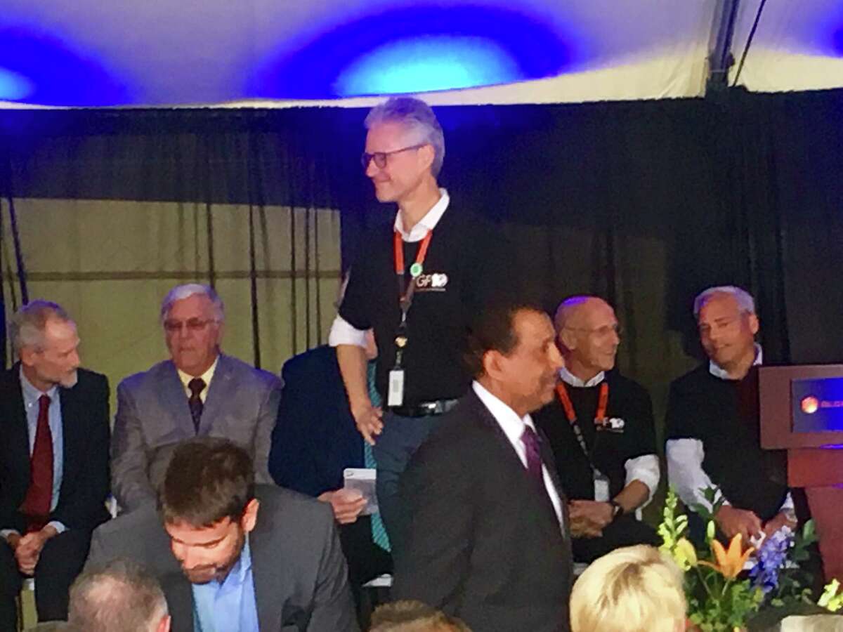 Ron Sampson, head of GlobalFoundries' U.S. operations, leading Wednesday's anniversary celebration of its Fab 8 factory. Ground was broken on the facility 10 years ago.