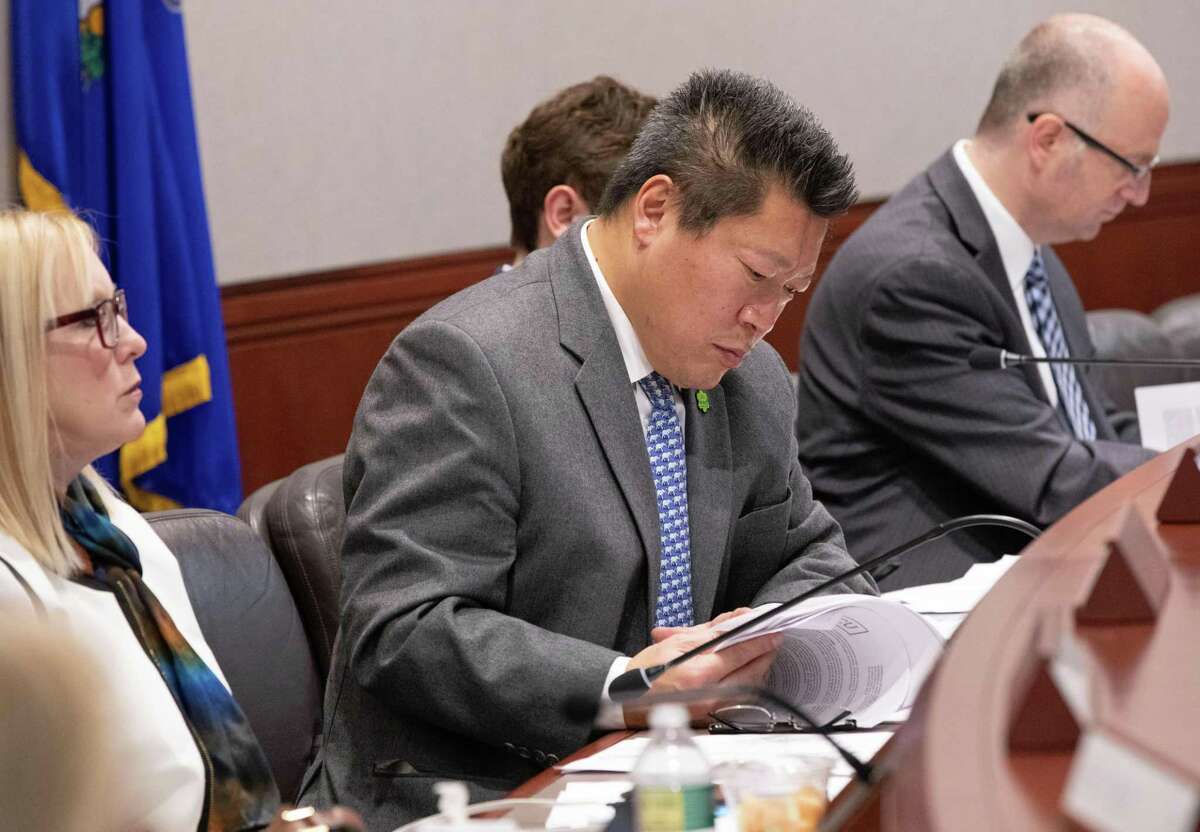 Sen. Hwang, who voted in favor of the package, at work on the Education Committee.