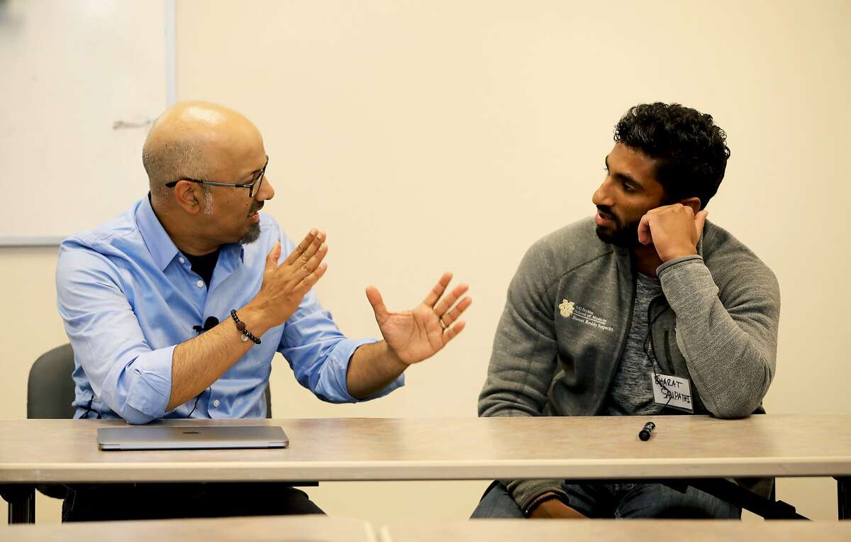 During a skit, Dr. Shashank V. Joshi (left), associate professor and director of school mental health, Stanford University, interacts with Bharat Sampathi, medical student, University of California, Irvine School of Medicine, in the Milton Marks Auditorium at the California State Building in San Francisco, Calif., on Friday, May 11, 2019. Stanford CHIPAO, or the Communication Health Interactive for Parents of Adolescents and Others, puts on plays and skits to help Chinese American families better understand the mental health needs of their children.