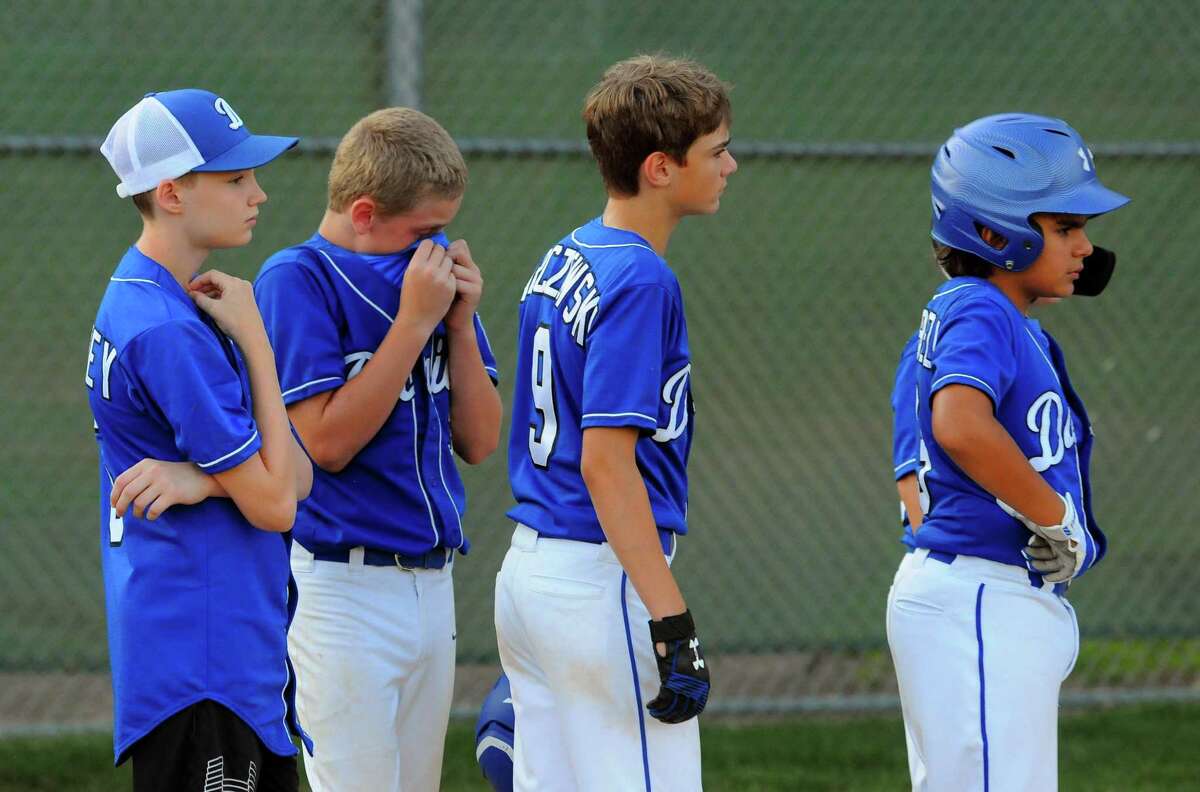 Darien team members line up at the conclusion of little league baseball action against North Haven at Unity Field in Trumbull, Conn., on Wednesday July 24, 2019. North Haven defeated Darien 7-1.