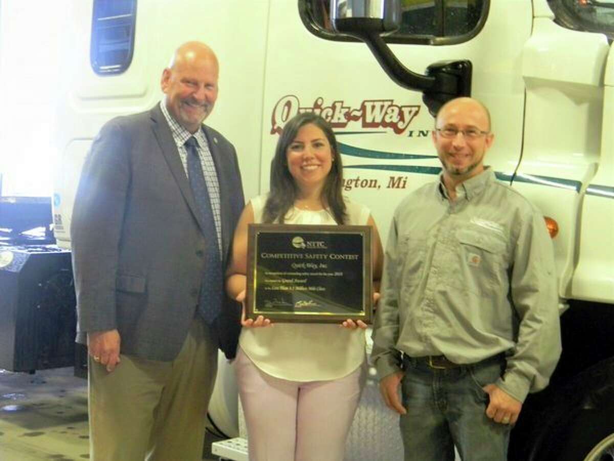 Senator Curt Vanderwall, left, celebrates with Quick-Way General Manager Melissa Alvarado, middle, and Herman McBride, right, a driver for Quick-Way who had the highest number of miles driven in 2018 with no safety incidents. (Photo provided)