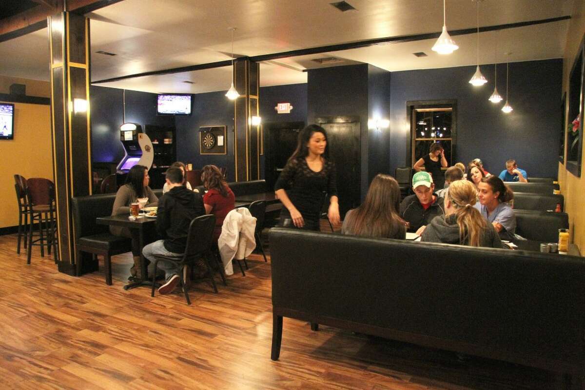 CHILL OUT: The restaurant, which seats about 78 people inside, was designed to have a relaxing, inviting atmosphere. “We wanted to be a place where a student, a professor or a local could come and relax, eat good food and have some drinks,” said co-owner Chris Mullins. (Pioneer photos/ Whitney Gronski-Buffa)