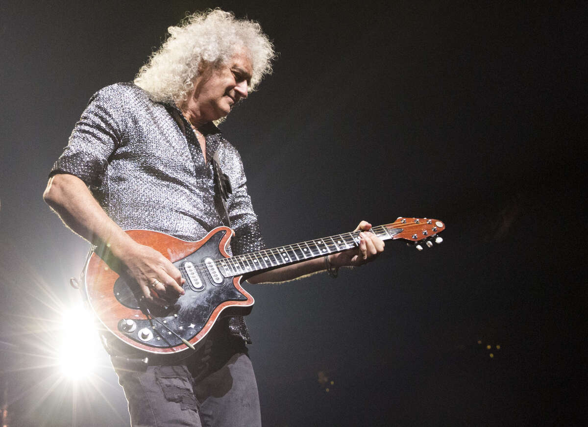 Brian May performs as part of Queen + Adam Lambert at Houston's Toyota Center on July 25, 2019.