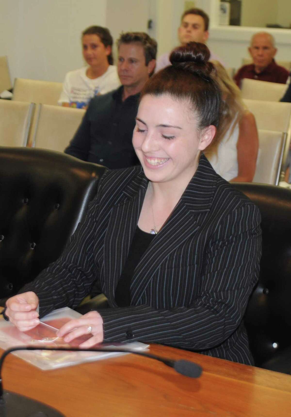 Siera Fergosi, a student intern in town hall, presented the Board of Selectmen with a proposal to create a town-wide sports code of conduct to be posted at playing fields. The plan would need approval from several town boards and also sports groups.