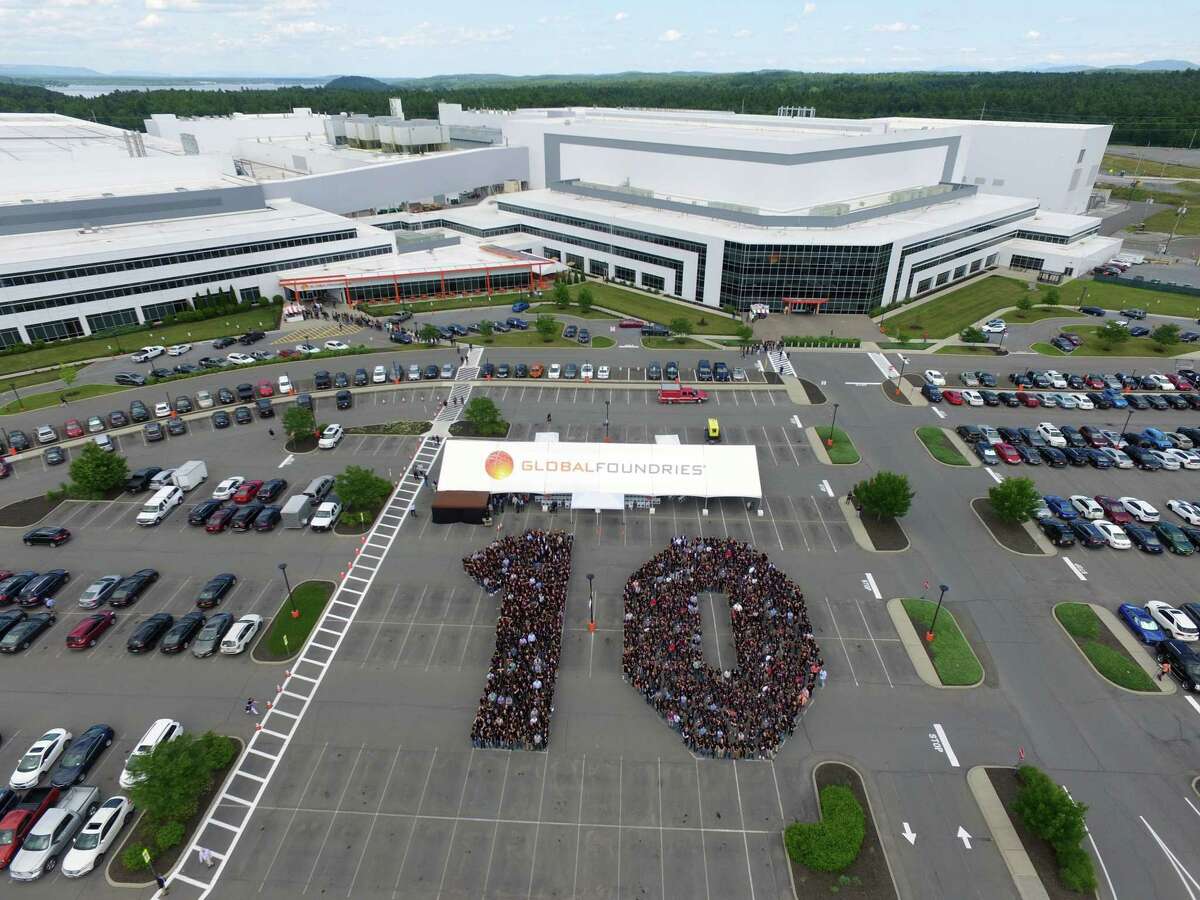 Employees at GlobalFoundries in Malta take a photo in the shape of a 10 to celebrate the 10th anniversary of Fab 8 back in 2019. The factory received $1.4 billion in state subsidies. Samsung is looking at a site in western New York for a new $17 billion fab, although it is unclear how large a financial incentive package Samsung would need from New York state.