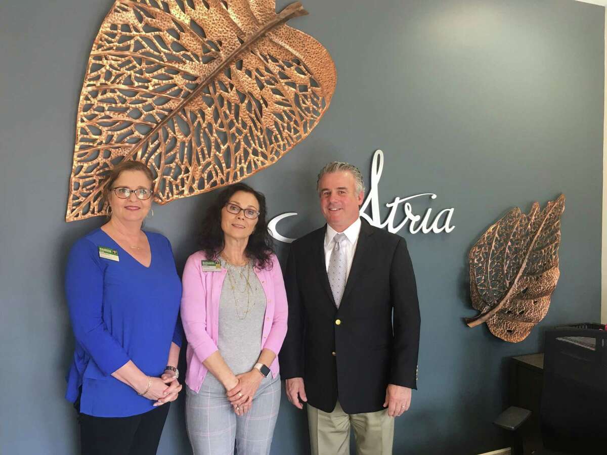 Maureen McLam, Margarida Velardo and John Hartmayer inside Atria Ridgefield's pop-up shop on Main Street. Atria Ridgefield will open on Old Quarry Road this fall.