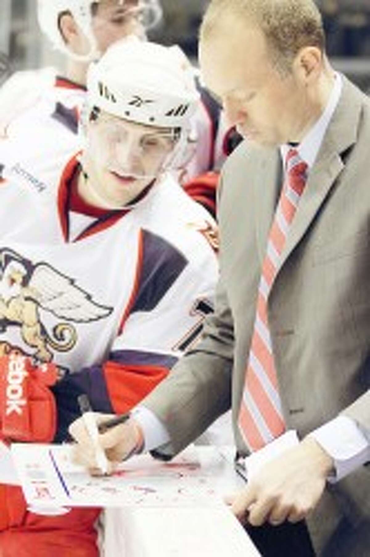 AT WORK: Former FSU player and assistant coach Jeff Blashill (right) is in his first season as coach of the Grand Rapids Griffins. (Courtesy photo/Mark Newman)