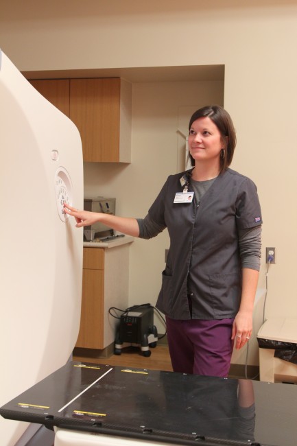Cancer survivor assists others with treatment at cancer center
