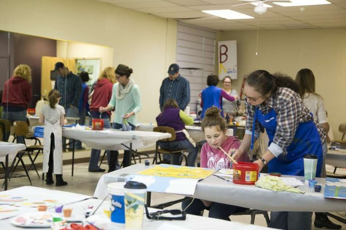 Community members participate in paint days for the Festival of Banners. Design submissions for this year's event are now being accepted until Jan. 31. Registration forms are available at Artworks in downtown Big Rapids. (Pioneer file photo)