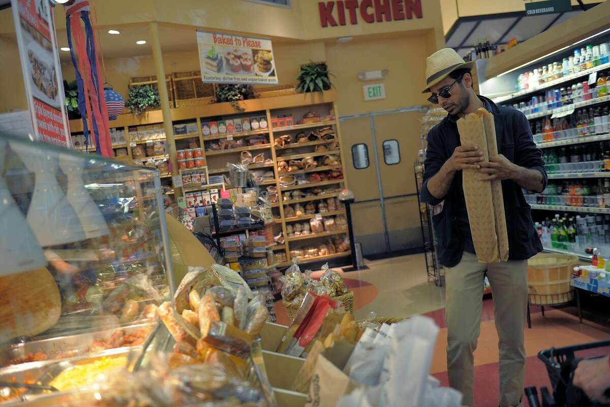 Mohamed Chaoua shops for groceries at Molly Stone's on June 17, 2014 in San Francisco, CA. Chaoua works as a driver for Uber between being a part-time musician and a single dad to a 5 year old daughter.