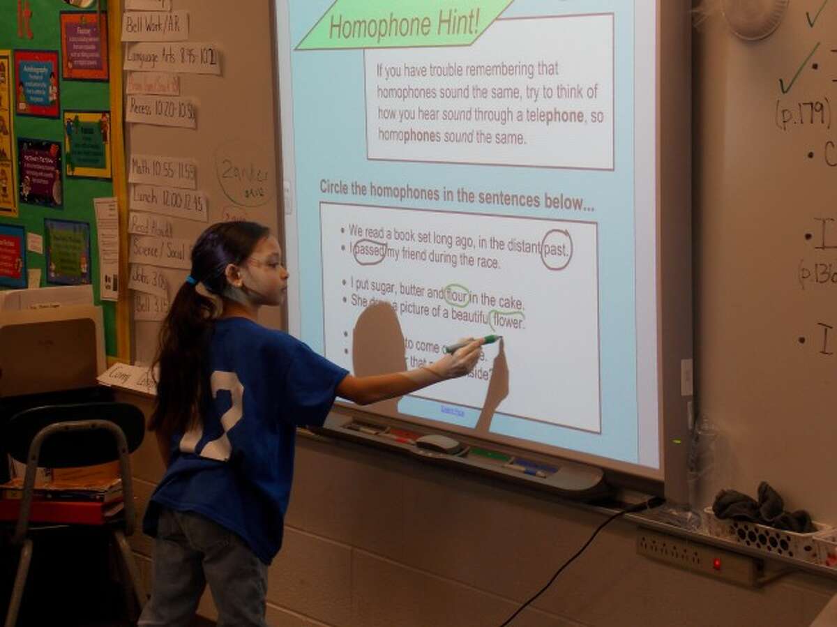 SMART BOARD: The "world of touch technology," the SMART Board, was first introduced to classrooms in the '90s. Students and teachers and Riverview enjoy using it for an interactive learning experience.