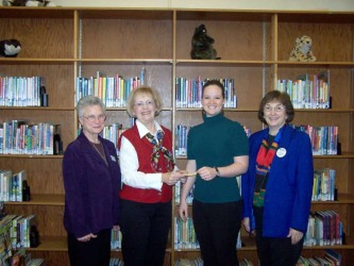 LIBRARY DONATION: Members of the Big Rapids Chapter of the General Federation of Women’s Club present a $1,000 donation to Big Rapids Community Library interim director Miriam Andrus to be used for the library renovation project. Pictured (from left to right) are Jerena Keys, of the Library Renovation Team and GFWC member; Dee Van Horn, GFWC president; Andrus; and Mary Ryan, of the library renovation team and GFWC member. (Courtesy photo)
