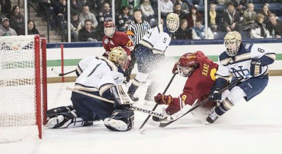 CRASH COURSE: Ferris State’s Cory Kane (8) looks to put a shot past Notre Dame goaltender Steven Summerhays during Saturday’s hockey action at Compton Family Ice Arena. (Courtesy photo/FSU Photo Services/Matt Yeoman)